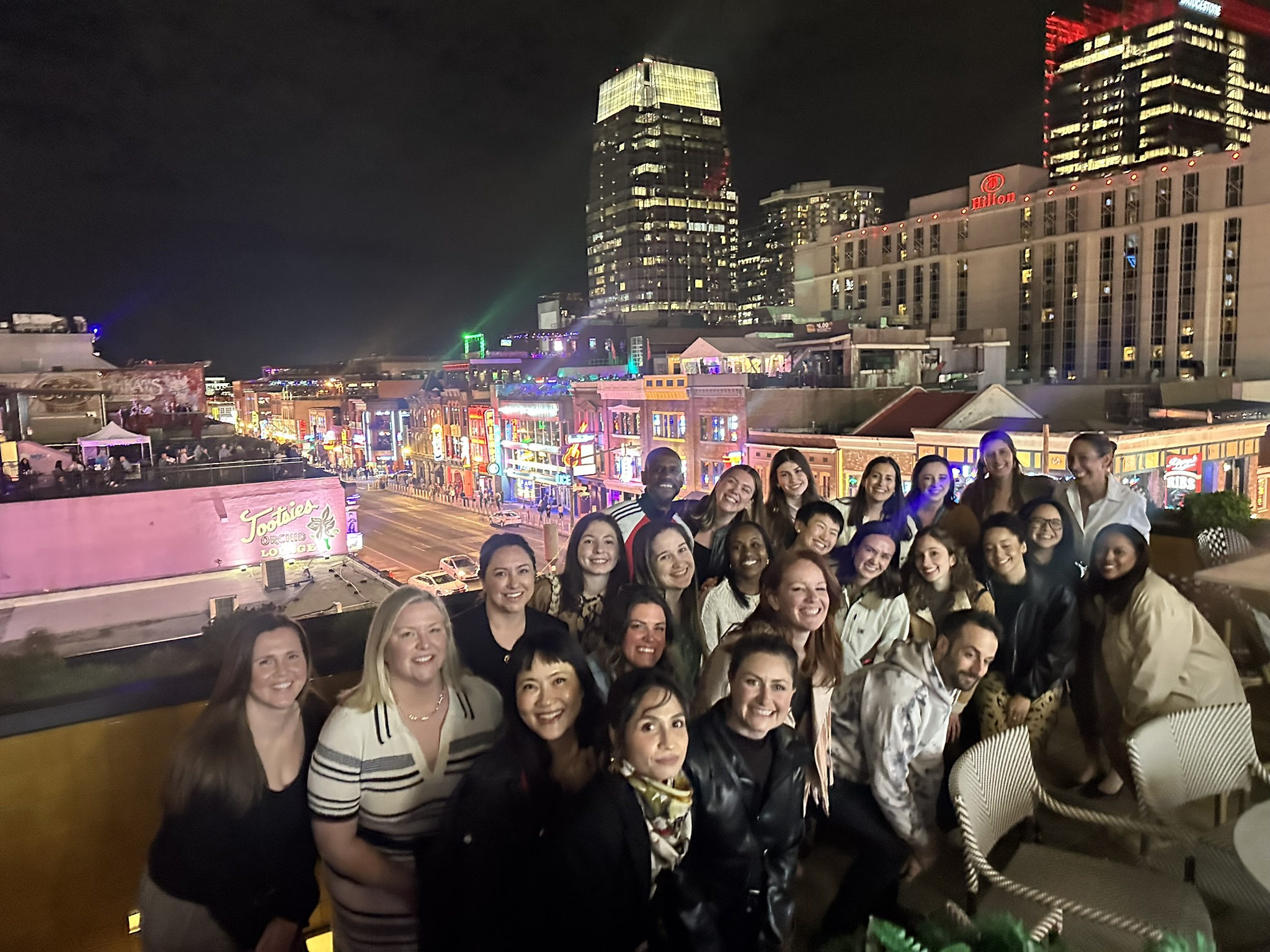 The COMMAND team together on a Nashville rooftop at night